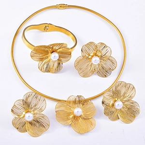 Exaggerated gold hollow flower jewelry set with pearls including necklace, ring, and earrings
