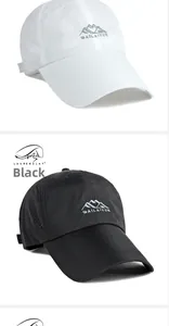 Detail of breathable mesh holes and mountain logo on black and white quick-dry caps
