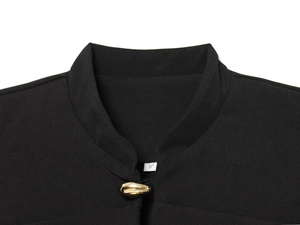 Detail of black blazer with gold irregular button and slim standing collar, size S