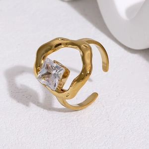 Detail of 18k gold plated stainless steel wave ring with a square zirconia stone inlay