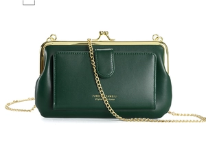 Detail of dark green PU leather crossbody bag with gold metal clasp and chain strap