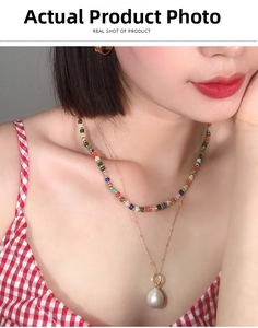 Detail showing layered colorful gemstone beaded choker and baroque pearl pendant necklace