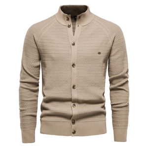 Close-up of khaki waffle knit texture and button collar on men's cardigan sweater