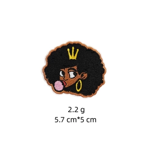 Close-up of Afro girl embroidered patch with bubble gum showing 5.7cm x 5cm size detail