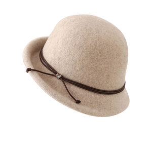 Beige wool felt cloche hat with brown leather cord and silver heart pendant detail