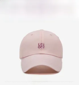 Detailed view of light pink cotton baseball cap with purple LENGE ncis embroidery detail