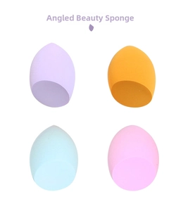 Close-up of four angled makeup sponges in pastel colors for precise base application