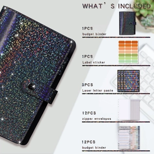 Macro shot of glittery black budget binder set with holographic binder and accessories