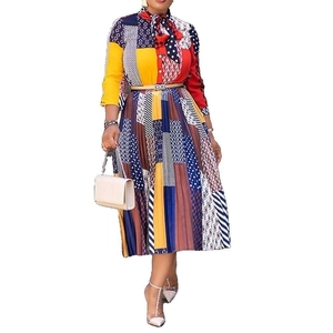 Detailed close-up of colorful patchwork pleated skirt with vibrant geometric patterns