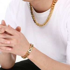 Men's gold-plated stainless steel bike chain necklace and bracelet set on model