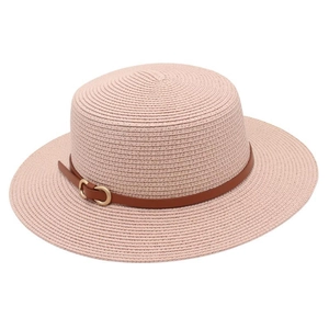 Detail of pink straw sun hat with brown leather band and gold metal buckle closure