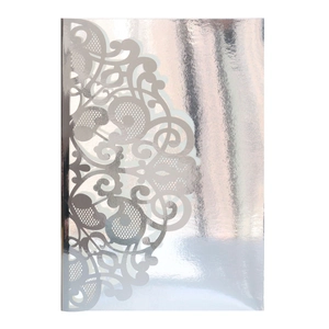 Detailed laser-cut silver wedding invitation cover with intricate hollow floral patterns