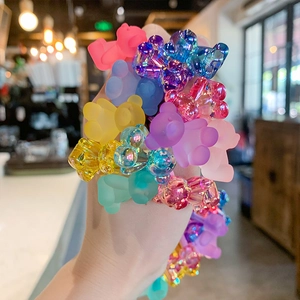 Colorful gummy bear hair ties set in frosted and translucent pastel candy shades