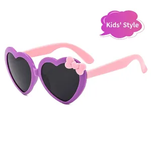 Cute heart-shaped children sunglasses with pink bow and UV protective lenses for girls