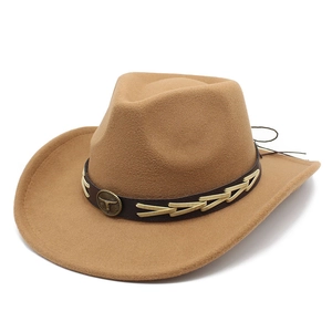 Detail of western wool fedora featuring leather band and metallic bull head emblem