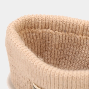 Close-up of thick elastic knitted headband showing warm khaki wool fabric texture