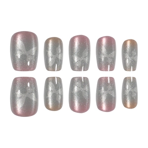 Detailed set of 10 cat eye press-on nails featuring silver butterfly bow patterns and gradients