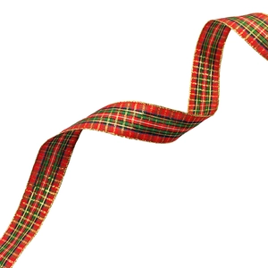 Detail of red and green plaid Christmas ribbon with gold wired edges in S-curve