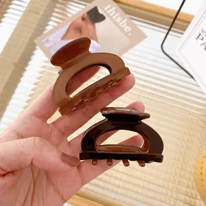 Brown tortoise shell large hair claw clips for thick hair set in stylish French resin