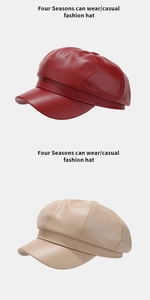 Detail of PU leather newsboy hats in deep red and beige with premium stitching and texture