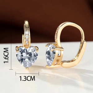 Macro view of gold plated heart shaped earrings with white cubic zirconia and dimensions