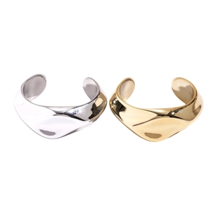 Minimalist irregular wavy open bangles set in polished gold and silver metallic finish