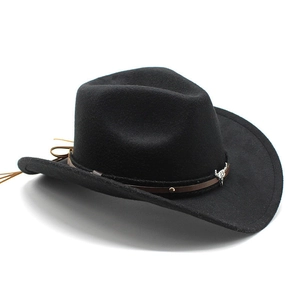 Detail of western black felt hat featuring a brown leather band and silver bull head ornament