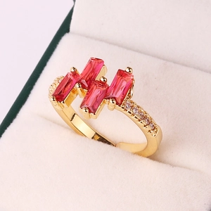 Gold plated open ring with four rectangular red zircons and sparkling side accents