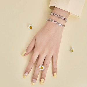 Detail of S925 sterling silver bracelets with colorful zircons on a model's wrist