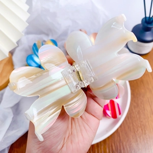 Pearlescent white acetate flower hair claw clip with colorful striped marble texture