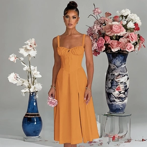 Detailed view of women's orange midi dress featuring a drawstring chest and slim fit design