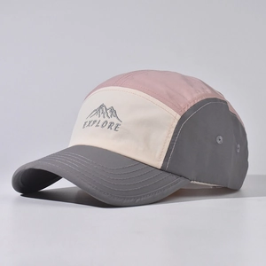 Detail of multi-color camper hat with mountain embroidery and breathable eyelets