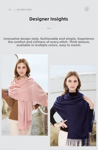 Close-up of thick winter scarf fringe details in pink and navy blue warm solid colors