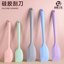 Detailed view of colorful food-grade silicone scrapers with ergonomic hanging handles