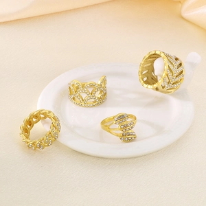 Luxe gold leaf and hollow pattern stainless steel rings with sparkling cubic zirconia