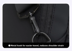 Detailed close-up of matte black metal swivel hook and nylon strap on a crossbody bag