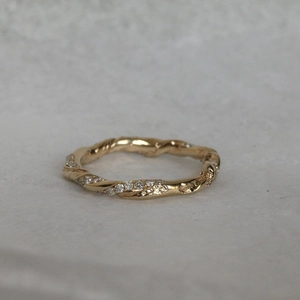 Irregular gold twisted ring with colorful zircon accents and luxury polished finish