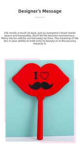 Detail of a red lip-shaped handheld makeup mirror with heart and mustache print