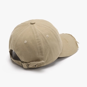 Vintage khaki washed cotton baseball cap with distressed brim and adjustable metal buckle