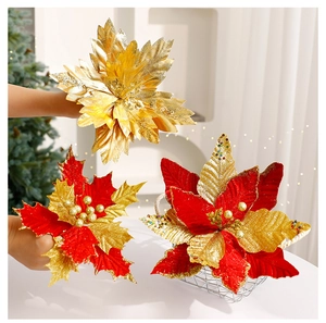 Detail of velvet Christmas poinsettia flowers with gold glitter and red sequins