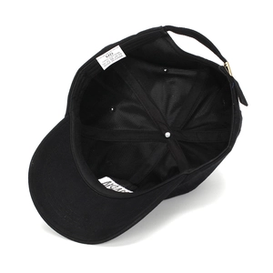 Internal view of black cotton baseball cap showing stitching and metal buckle