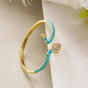 Bohemian gold snake ring with sky blue enamel and sparkling white zircon stones
