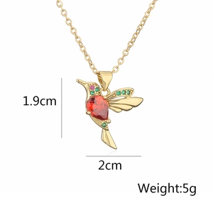 Detail view of bird necklace showing 1.9cm by 2cm dimensions and 5g weight data