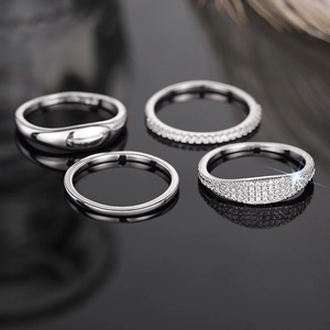 Detail view of a 4-piece silver minimalist ring set with sparkling zircon micro-paving