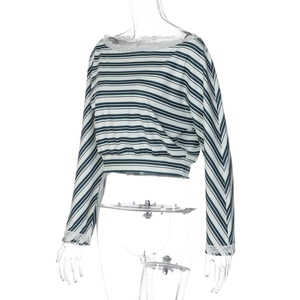 Detail of blue and white striped crop top featuring delicate lace trim on neck and cuffs