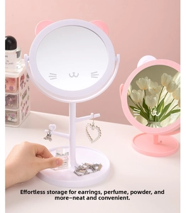 Detail of cute cat-ear makeup mirror featuring jewelry storage hooks and base organizer