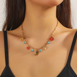 Vintage gold layered necklace with horseshoe, red heart lock, and boot charms