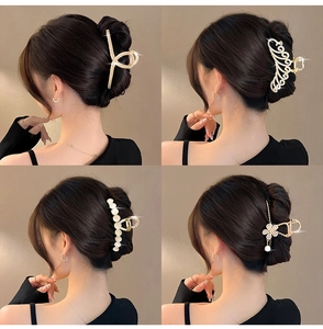 Elegant set of four large metallic gold hair claw clips with pearls and crystal details