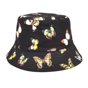 Reversible black cotton bucket hat with colorful butterfly print for outdoor sun protection