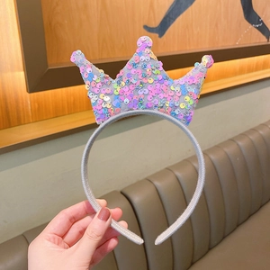 Detail of a sparkling sequin princess crown headband for girls in vibrant colors